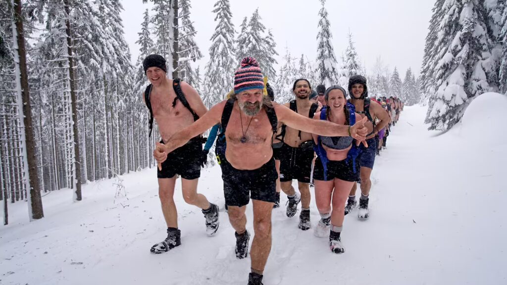 Wim Hof leading a group on a cold expedition in the snow